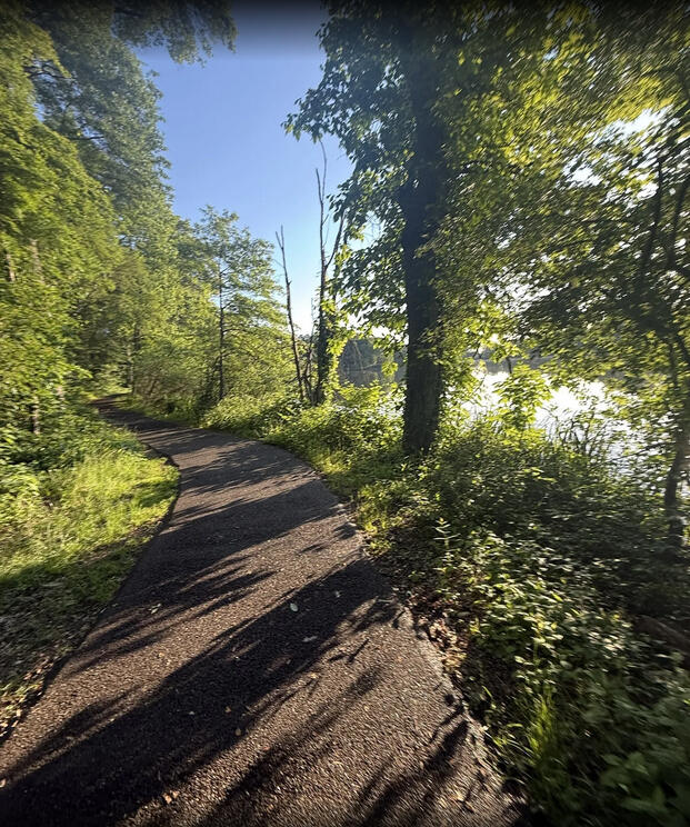 Riding my board along the Weequahic Lake Trail.